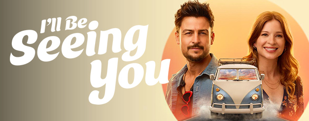 Promotional graphic for Hallmark's 2026 film "I'll Be Seeing You," featuring smiling man Tyler Hynes as Mark Appleyard and Stacey Farber as Amy standing on either side of a small vintage-style van named Mable, set against a warm circular yellow and orange background.