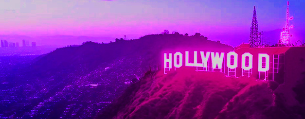 The Hollywood sign illuminated at night, stylized with a vibrant neon purple and pink aesthetic, overlooking a sprawling cityscape under a glowing gradient sky.