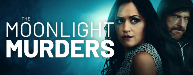 Title card for "The Moonlight Murders" featuring Harley Bronwyn as May, a woman with dark hair looking back with an alert expression, standing in front of Clayton Louis as Zeke, a man wearing a dark hoodie. The background is a moody, blue-toned night scene.