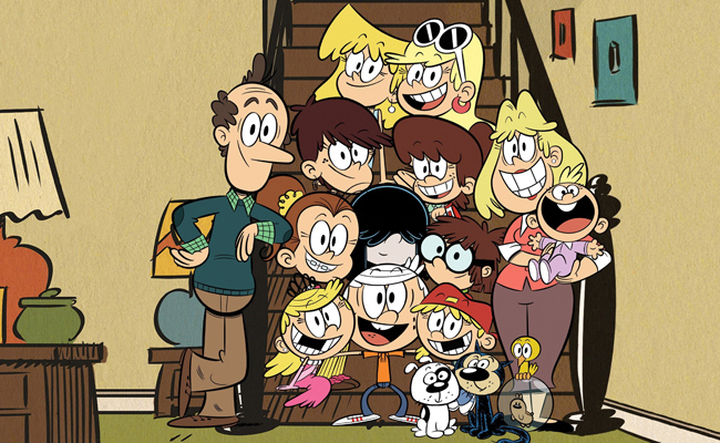 Still image from animated series "The Loud House" featuring a cartoon family of a father, mother and eleven children, with two dogs, a bird, and a hamster in a clear ball, are posed together on and around a staircase. Two brown end tables, each with a lamp, one orange and one blue, with a green jar on the foreground table. A red and blue framed picture hangs on the right wall above the staircase.