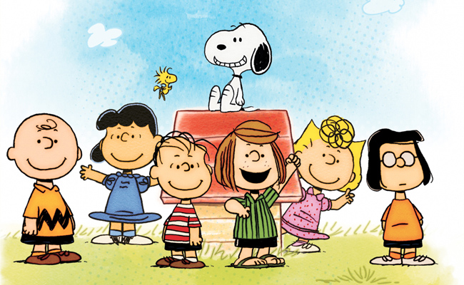 From "Peanuts by Schulz", Illustration of Peanuts characters Charlie Brown, Lucy, Linus, Peppermint Patty, Sally Marcie, gathered outdoors on a sunny day, with Snoopy sitting atop his dog house with a red roof, Woodstock hovering in the air to the left.